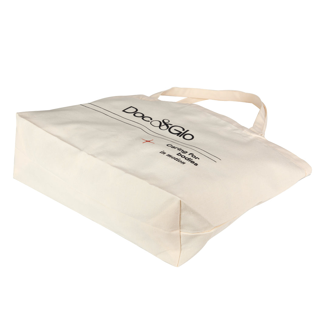 Beige Tote Bag with 'Doc & Glo' branding on a white background