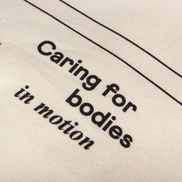 Text 'Caring for bodies in motion' on a fabric background